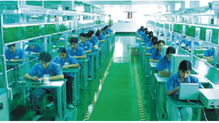 SMT production line with operators and assembly stations